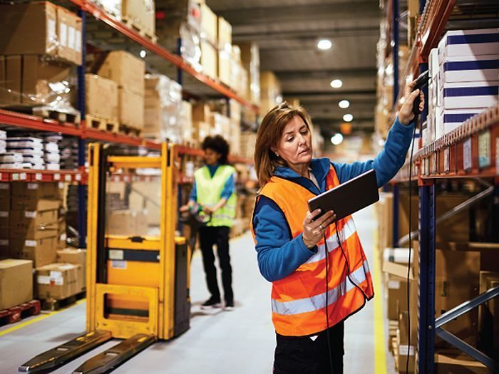 Warehouse lead checking updates on a tablet